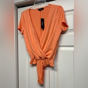 New with tags Lulu's Vibrant Orange Wrap Bodysuit